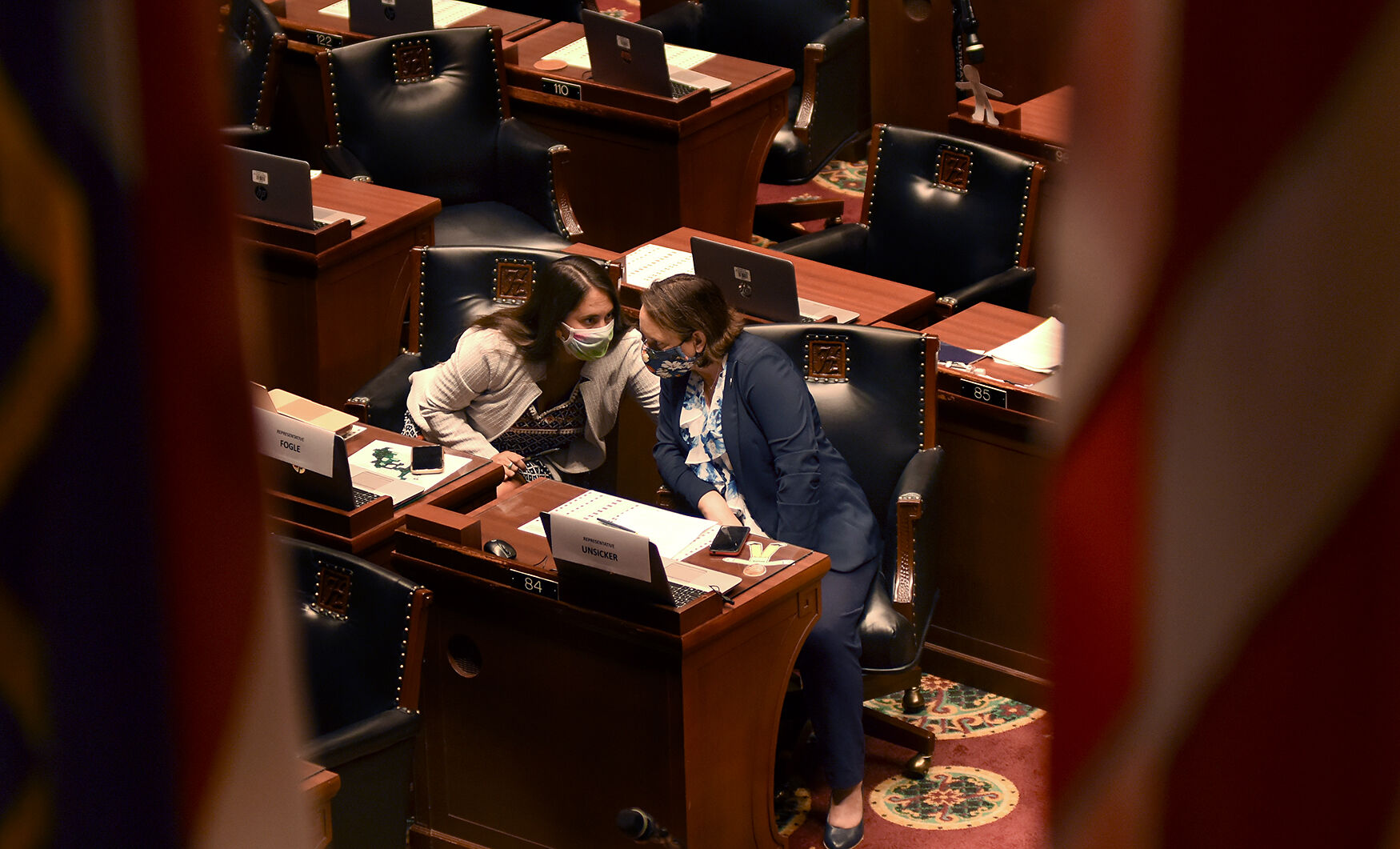 Rep. Betsy Fogle, left, talks to Rep. Sarah Unsicker